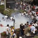 Turkish riot police use tear gas to disperse demonstrators during protest against destruction of trees in park brought about by pedestrian project, in Taksim Square in central Istanbul